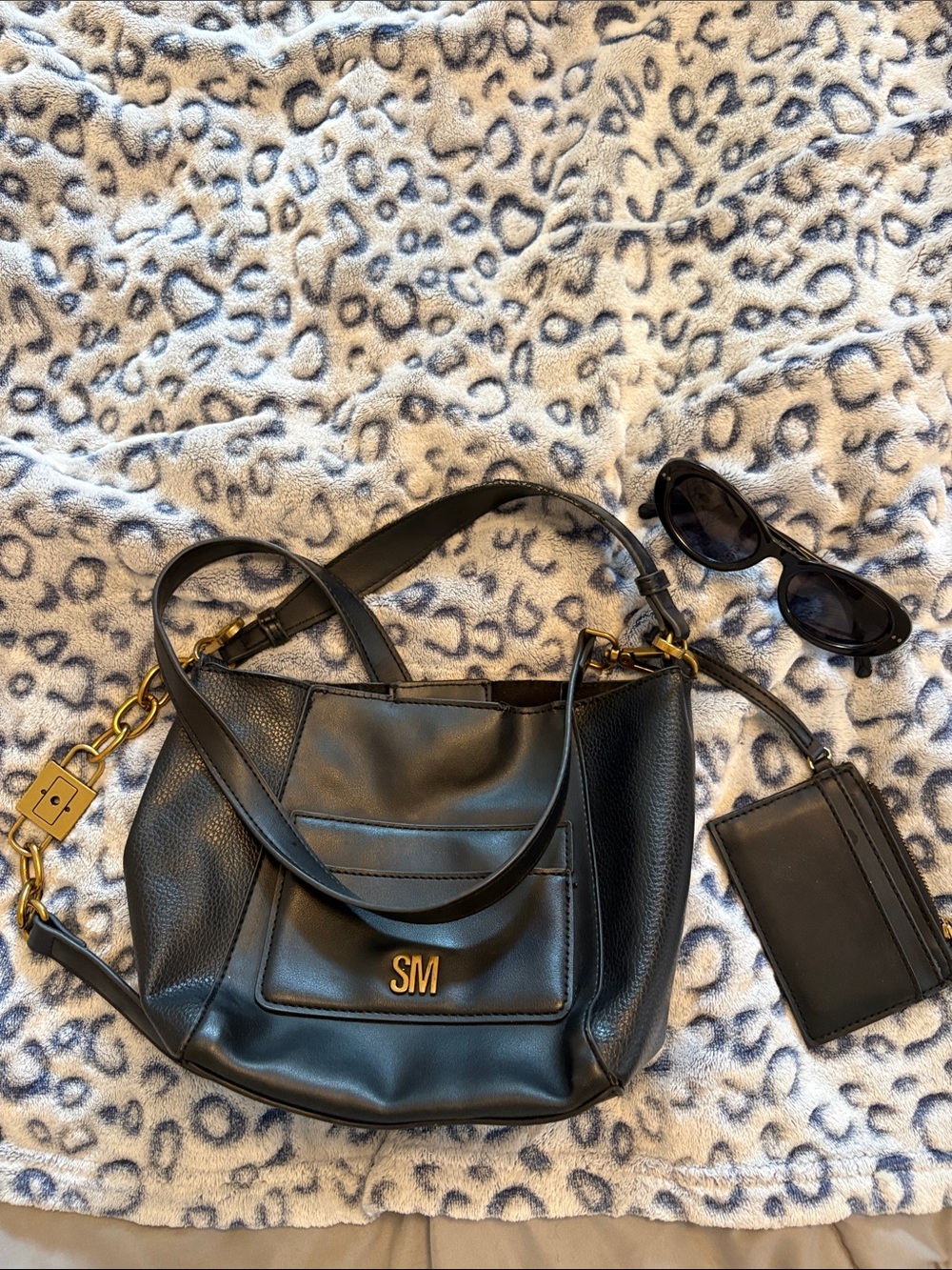 Steve Madden Black Leather Shoulder Bag with Gold Hardware and sunglasses
